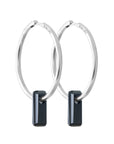 silver earrings, large hoop earrings, black stone through hoops, white background.
